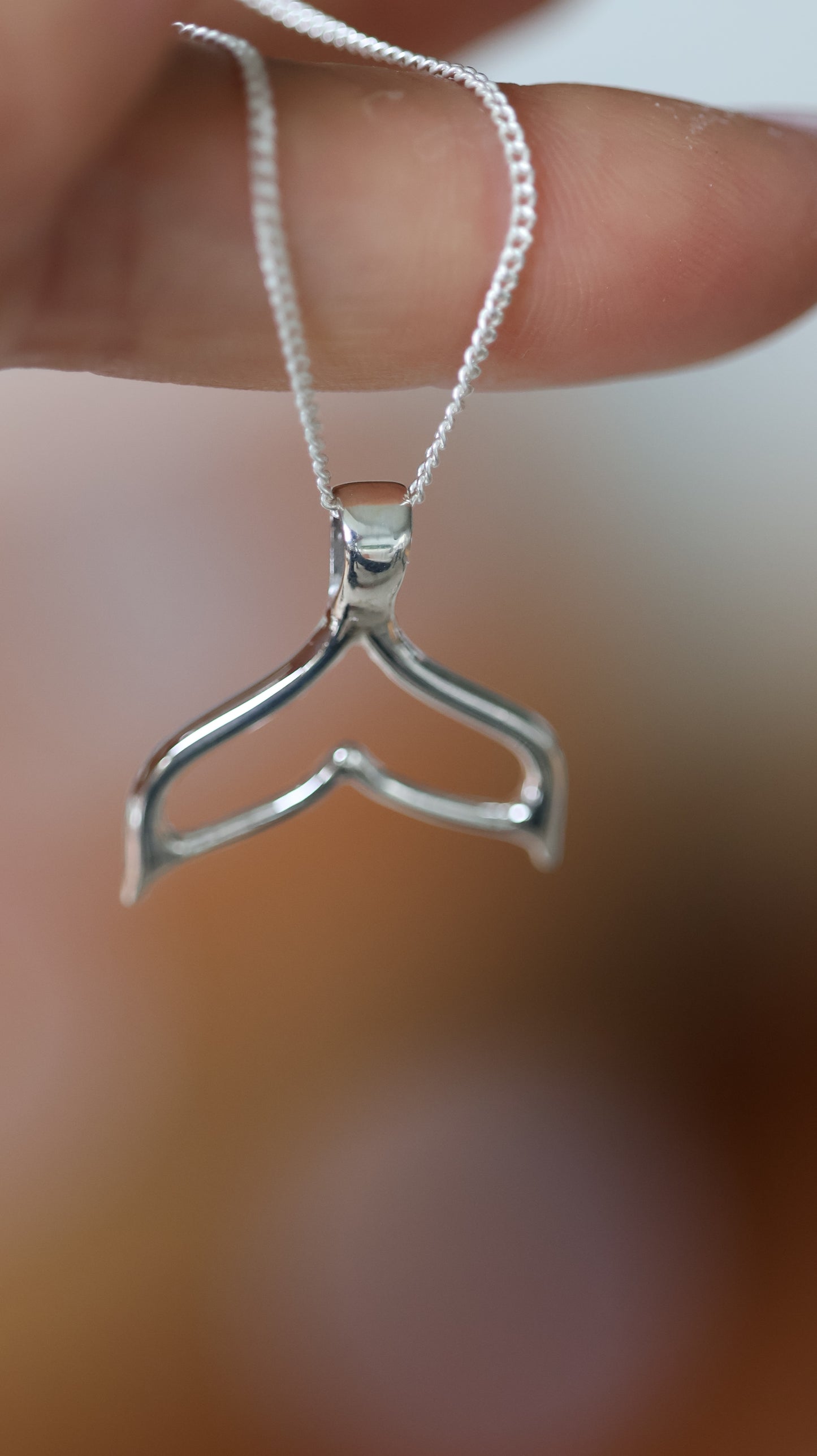 Whale tale pendant