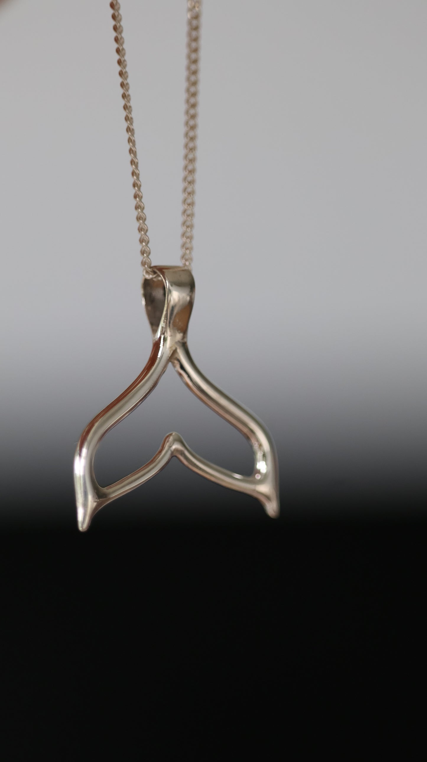 Whale tale pendant
