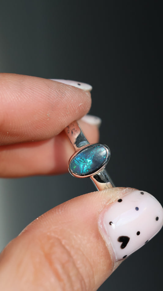 Solid semi-dark Lightning Ridge opal Ring