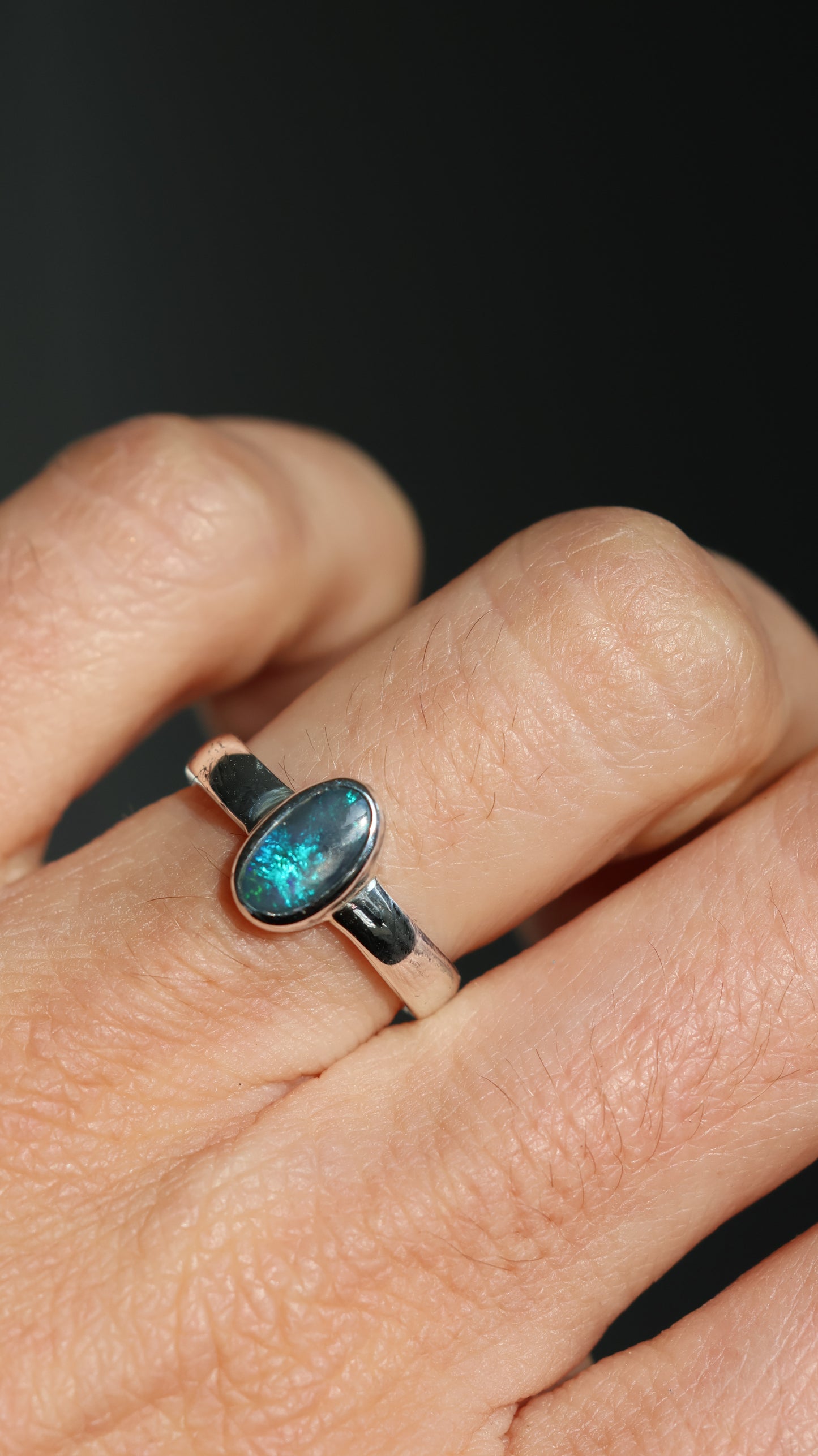 Solid semi-dark Lightning Ridge opal Ring
