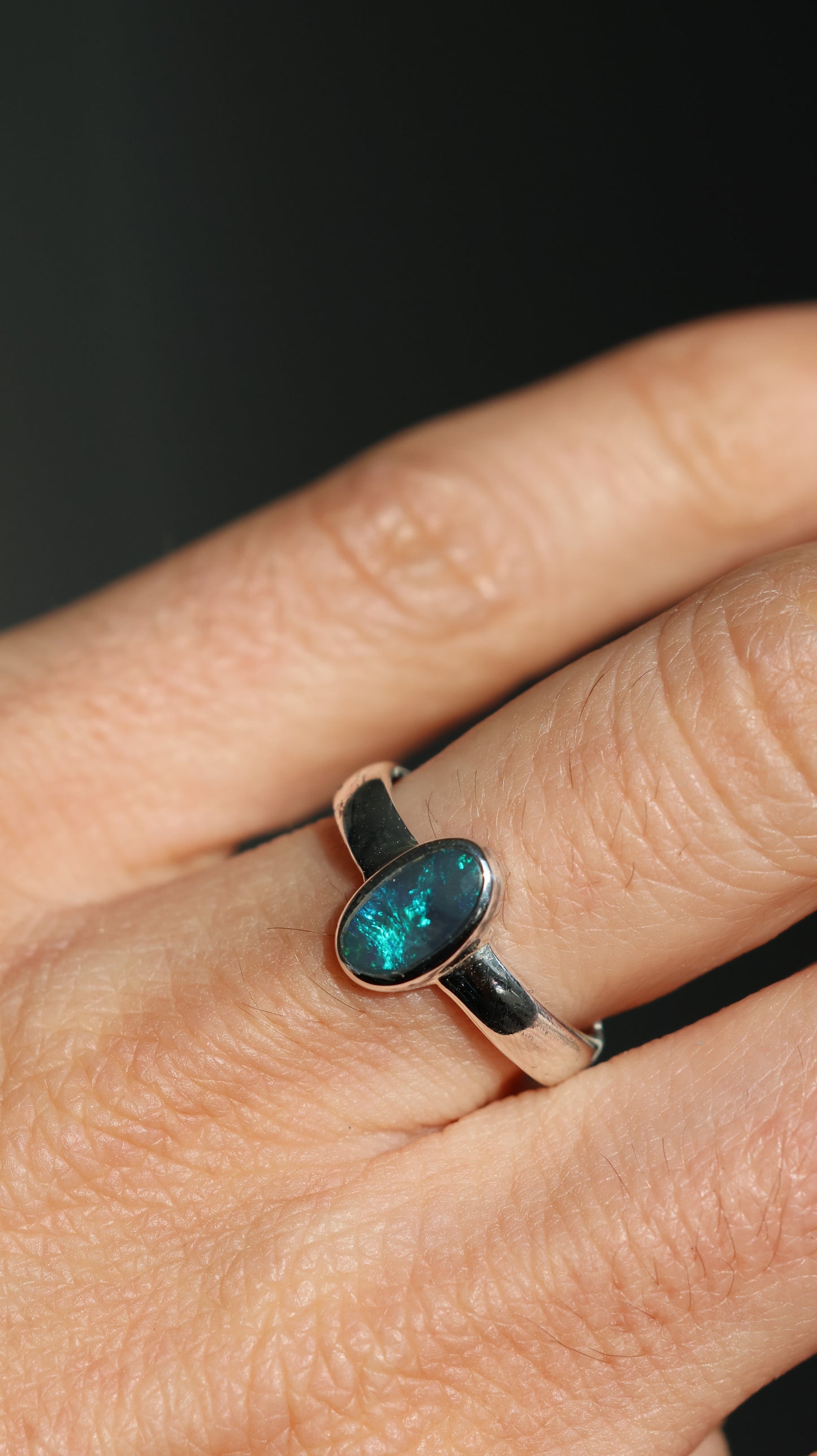 Solid semi-dark Lightning Ridge opal Ring